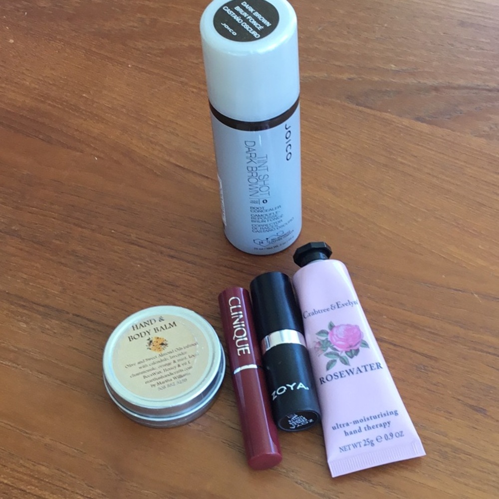 Lot of beauty products. Root concealer, lip color